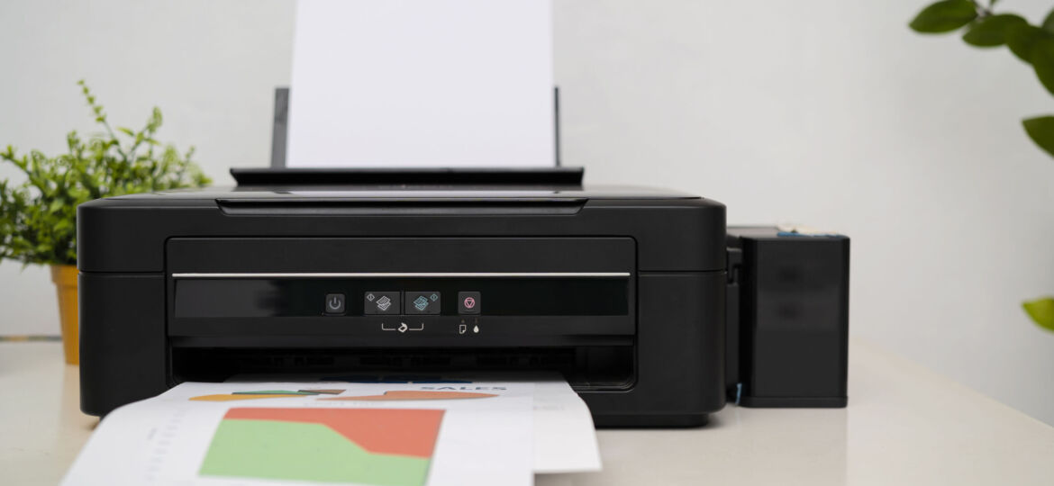 black printer in office with soft-focus
